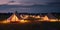 Glamping at night, glowing tents, nightlights