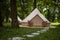 Glamping tent in the woods on a calm afternoon.