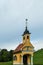 Glanz - A a small yellow church between a lush wine region is South Styria, Austria. The wine plantations