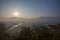 Glaring sunrise over Luang Prabang mountains, river