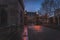 GLASGOW, SCOTLAND, DECEMBER 16, 2018: Beautiful cobbled street surrounded by old European style buildings. Illuminated only with