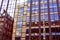 Glasgow tenements reflected in the windows of modern buildings