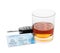 Glass of alcohol, car key and driver license on white background.