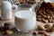 A glass of almond milk with unshelled and shelled almonds