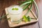 Glass of aloe vera juice on wooden background