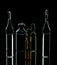 Glass ampoules with liquid on a black background. Medical items. Virus. Prevention and treatment