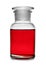 Glass apothecary bottle with red liquid sample isolated. Laboratory analysis