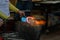 Glass Artist in her workshop making glassware