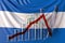 Glass bar chart with downward trend against flag of Nicaragua. Financial crisis or economic meltdown related conceptual
