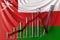 Glass bar chart with downward trend against flag of Oman. Financial crisis or economic meltdown related conceptual 3D