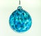 Glass bauble.  Single hand blown glass Christmas tree ornament in clear translucent aqua blue