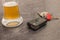 Glass of Beer and car key on grey table