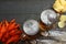 Glass beer with crawfish, dried fish and wheat ears on dark wooden background. Beer brewery concept. Beer background. top view