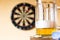 Glass of beer and dartboard