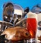 Glass of beer and dried fish, washed clean pans