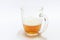 Glass of beer half filled with beer on white background