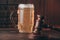 Glass of beer and judge gavel on a wooden table close-up. Alcohol and crimes concept