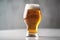 A glass of beer on a light background with selective focus. Generative AI