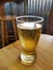 Glass of Beer on Pub Table