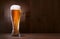 Glass beer on wood background