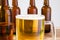 Glass of beer on wooden table, top view. Beer bottles. Selective focus. Mock up. Copy space.Template. Blank.