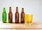 Glass of beer on wooden table, top view. Beer bottles. Selective focus. Mock up. Copy space.Template. Blank.