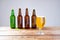 Glass of beer on wooden table, top view. Beer bottles. Selective focus. Mock up. Copy space.Template. Blank.