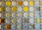 Glass block wall of blue-yellow colors. Oriental pattern, texture