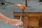 Glass blower shaping molten glass