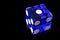 Glass blue dice on a black background, macro photo. Left copy space. Isolated on a black background with a small reflection.