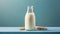 Glass bottle of milk on top of blue counter. Tasty and healthy beverage. Fresh drink