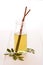 Glass bottle with moringa leaf tea, recyclable drinking straws made with stainless steel, moringa dry leaves and powder on wooden