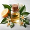 glass bottle of neroli essential oil on white background