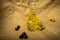 A glass bottle of olive oil on a background of green olives, black olives and homespun fabric with a rough texture. Close up