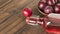 Glass bottle with plum alcohol and ripe plums on the table.