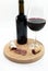 Glass and bottle with red wine and dry crusty salami relaxation wine tasting luxury concept