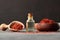 Glass bottle of saffron essential oil with dried saffron, spice or herb oil concept