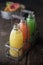 Glass bottles of assorted fresh fruit juice