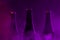 Glass bottles of beer on purple foggy smoke dark background.Abstract background , drink, party lifestyle concept