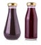 Glass bottles with dark sauce on a white background