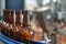 Glass bottles with light filtered beer on the conveyor. Industrial production of beer