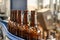 Glass bottles with light filtered beer on the conveyor. Industrial production of beer