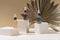 Glass bottles with a pipette of aroma oil, liquid serum or hyaluronic acid in a modern studio.