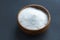Glass bowl of baking soda. Spoonful of bicarbonate. Baking soda, Sodium bicarbonate, NaHCO3