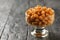 Glass bowl with boiled chickpeas on a dark wooden table