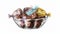 a glass bowl filled with assorted chocolates on top of a white tablecloth covered tablecloth with a gold foiled bag of chocolates