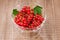 glass bowl full of red currant/glass bowl full of red currant. Top view