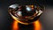 A glass bowl with a glowing orange light