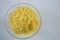 Glass bowl of grated cheese