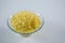 Glass bowl of grated cheese